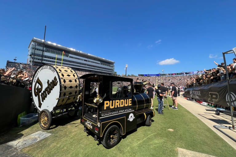 Xtra on the football field with Big Bass Drum